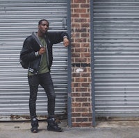 a man leaning against a garage door