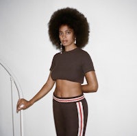 a woman with an afro posing for a magazine